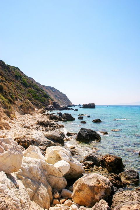 Paliolinos: A rocky beach with azure waters