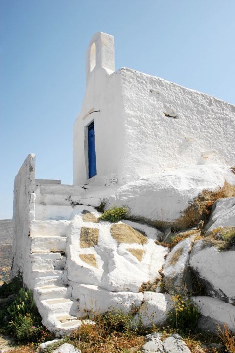 Chora: A whitewashed, Cycladic chapel with a blue door